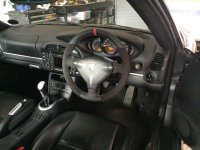 996-986-slightly-thicker-black-alcantara-9040-sides-horizontal-upper-joints-smooth-top-bottom-red-centre-band-at-12-oclock-silver-stitching