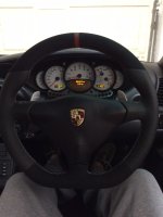 Porsche-996-2004-3-spoke-Black-–-Slightly-thicker-with-Flat-bottom-Black-Perforated-leather-on-sides-Black-alcnatara-9040-top-bottom-Red-centre-stripe-Dark-silver-stitch