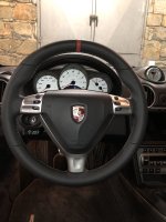 987997-Triangular-airbag-Black-Thicker-Thumb-grips-Added-Perforated-leather-on-sides-Smooth-too-bottom-Red-centre-stripe-at-12-oclock-Dark-grey-416-stitching-0