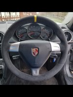 987997-tringular-airbag-Black-Slighlty-thicker-Thumb-grips-built-up-Dark-grey-Alcantara-9002-Yellow-centre-stripe-at-12-Dark-grey-416-stitching-1