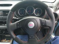Impreza-perforated-sides-black-alcantara-topbottom-Red-stitching-1