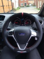 Fiesta ST 2014 - Slighlty thicker, Perforated leather on sides, Black alcantara top-bottom + Red centre stripe at 12 o'clock, Red stitching 1