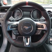 Mustang 2016 – Thicker, Thumb gripsadded + Flat bottom, Perforated leather on sides, Alcantara top-bottom + Red centre stripe at12 o'clock, Red stitching 1