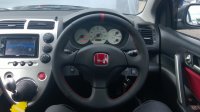 Civic Type-R - -slightly thicker, perforated sides, smooth top-bottom + red centre stripe, red stitching