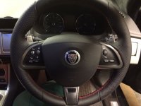 Jaguar XF,XK - thicker, thunb grips built up, perforated on the sides, nappa leather ( vertical joints), red stitching.