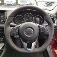 Mazda-6-CX5-Thicker-Thumb-grips-built-up-Flat-bottom-Peforated-leather-on-sides-Smooth-top-bottom-Red-stitching-1