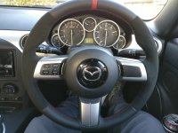 MX5-mk3-Slightly-thicker-Thumb-grips-added-Black-Alcantara-onsides-Smooth-leather-topbottom-Red-centre-stripe-Red-stitching