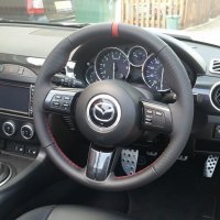 MX5 mk3 - Slightly thicker, Thumb grips added, Perforated leather on sides, Nappa topbottom + Red centre stripe, Red stitching 1