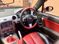 MX5-mk3-Slightly-thicker-Thumb-grips-added-Perforated-leather-on-sides-Red-topbottom-Black-perforated-centre-stripe-Red-stitching