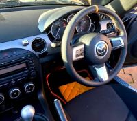 MX5 mk3 - Slightly thicker, Thumb grips added, Perforated leather on sides, Smooth top/bottom + Red centre stripe, Red stitching