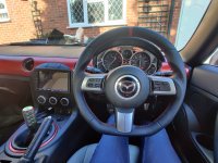 MX5-mk3-NC-2011-M0dificaiotn-with-Flat-bottom-Profiles-Perforated-leather-on-ides-Smooth-top-bottom-Red-Centre-satripe-Red-stitching
