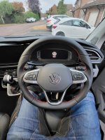 VW-T6.1-Full-Modification-with-Flat-bottom-Perforated-leather-on-sides-Smooth-top-bottom-Red-stitching-1