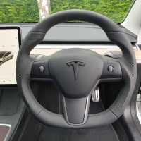 Tesla-3-2020-Full-modification-with-Flat-bottom-PROFILES-Perofrated-leather-on-sides-Smooth-top-bottom-Dark-grey-416-stitching-1