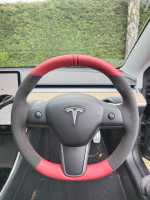 Tesla-Model-3-2019-NON-heated-Dark-Grey-Alcantara-9002-on-sides-Red-leather-top-bottom-Red-centre-stripe-Red-stitching-1