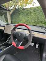 Tesla-Model-3-2019-NON-heated-Dark-Grey-Alcantara-9002-on-sides-Red-leather-top-bottom-Red-centre-stripe-Red-stitching-2