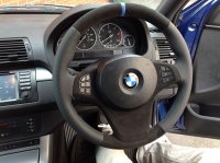 X5 E53 facelift, X3 E83 - slighlty thicker, perforated sides, black alcantara + blue band at 12 o'clock, M stitching 2